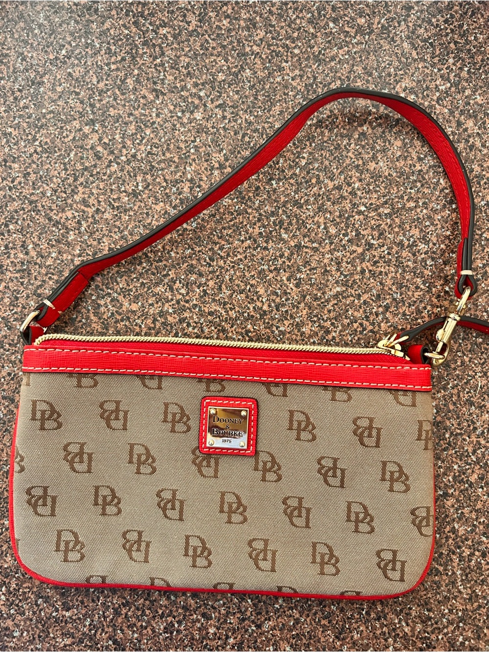 Dooney & Bourke Tan Signature Wristlet with Red Trim